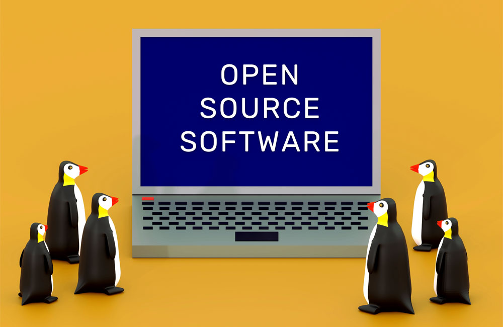 ラップトップ画面にOPEN SOURCE SOFTWARE の文字と6羽のペンギン